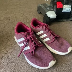 Women’s maroon adidas tennis shoes.